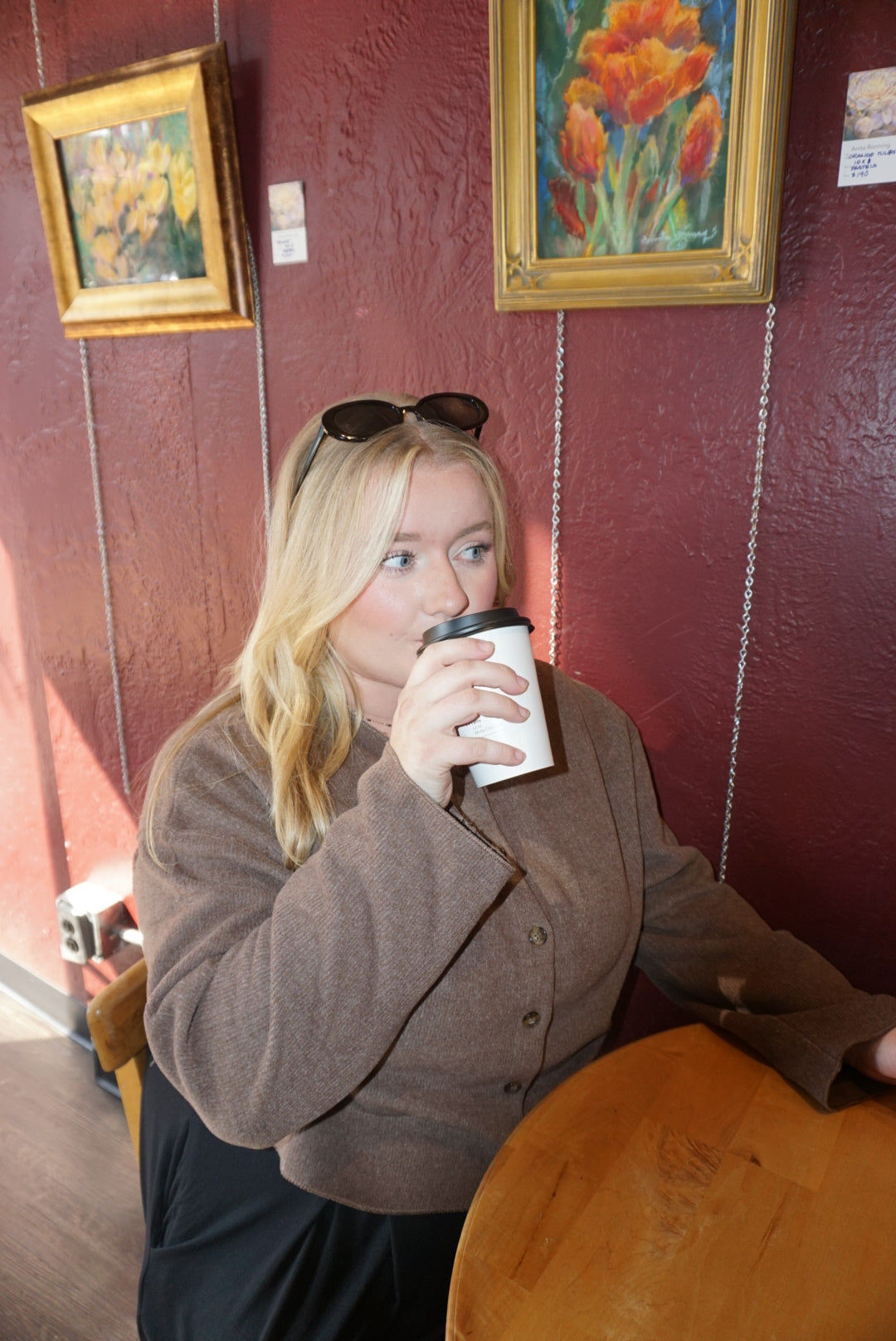 A luxurious ribbed material cardigan, in a lovely chocolate brown color, with a button down front.