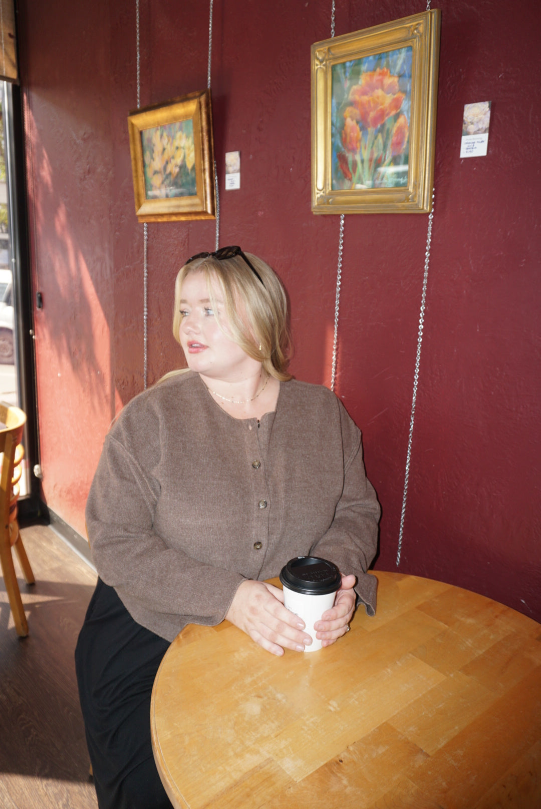 A luxurious ribbed material cardigan, in a lovely chocolate brown color, with a button down front.