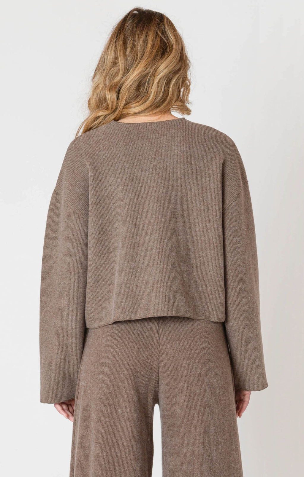 A luxurious ribbed material cardigan, in a lovely chocolate brown color, with a button down front.