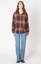 A flannel style button up shirt, with orange, blue, and red autumnal colors. 