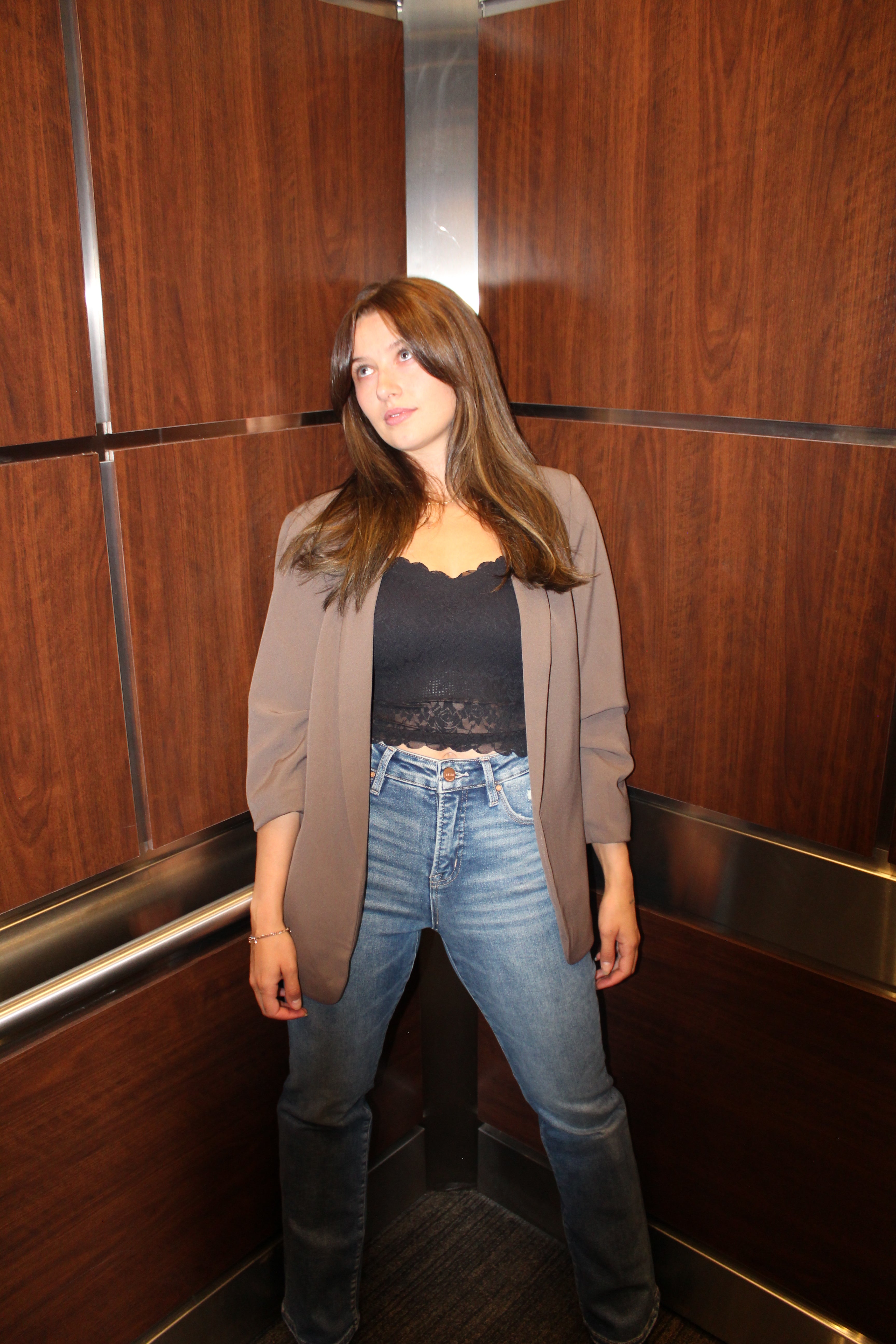 An ash brown blazer with scrunched sleeve detail and open front.