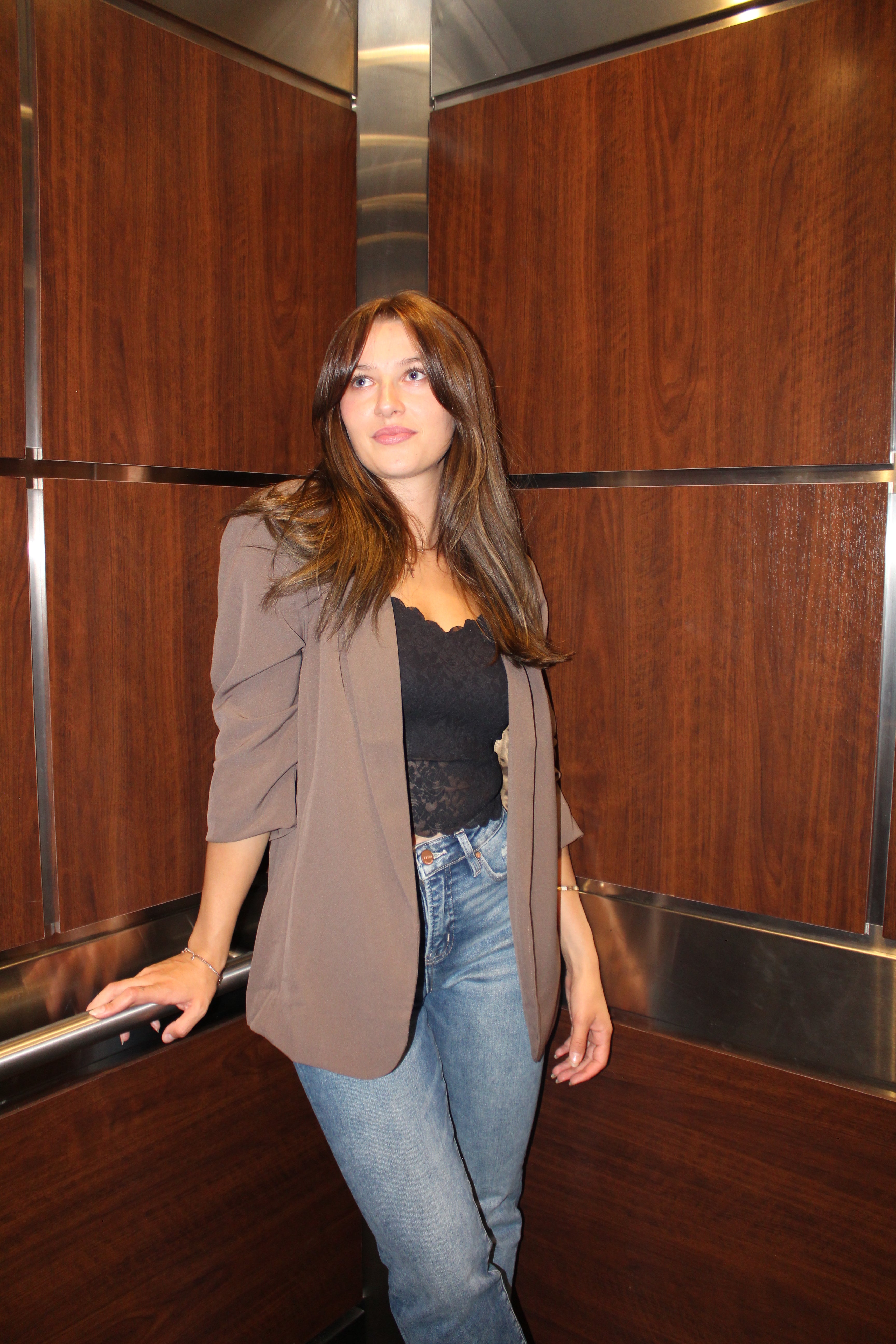An ash brown blazer with scrunched sleeve detail.