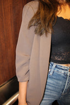 An ash brown blazer with scrunched sleeve detail.