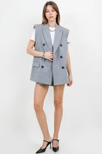 A grey suit jacket style vest, with double-breast buttons, slightly padded shoulders, and pinstripe details.