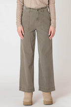 Super cute sage green denim material pants, with wide legs and a tall hem.