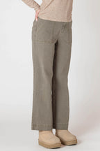 Super cute sage green denim material pants, with wide legs and a tall hem.