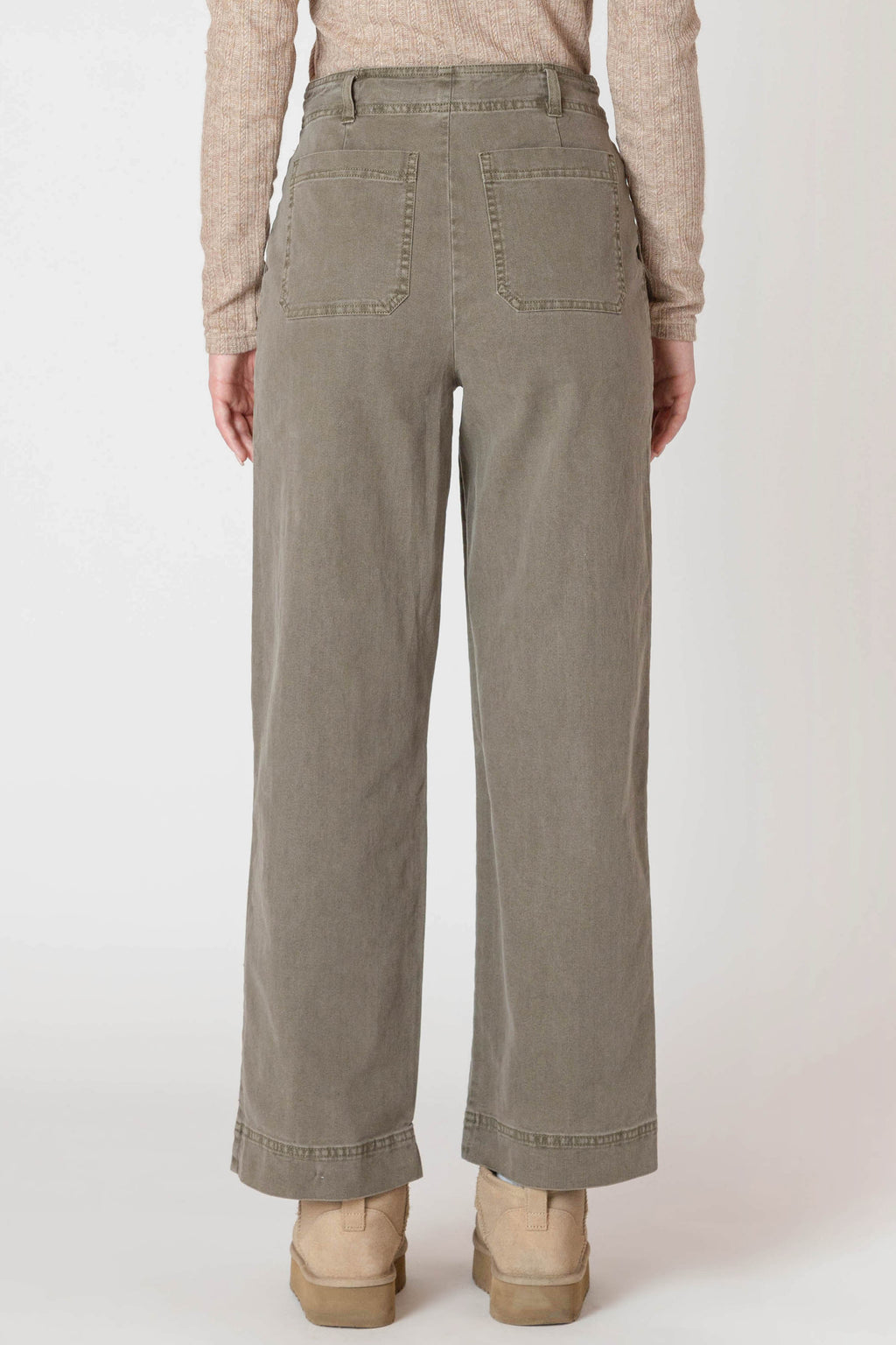 Super cute sage green denim material pants, with wide legs and a tall hem.