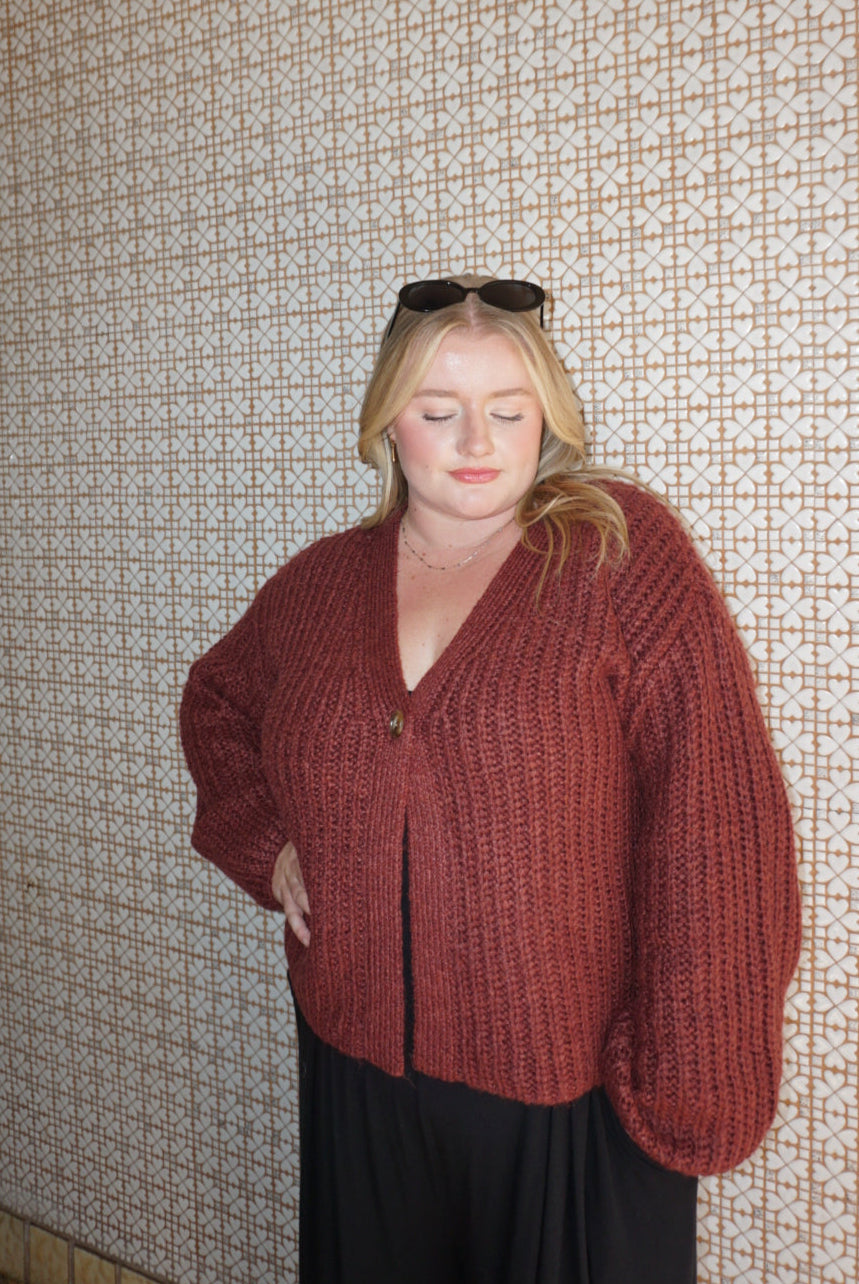 A cozy chunky knit burgundy sweater. 