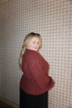 A cozy chunky knit burgundy sweater. 