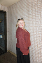 A cozy chunky knit burgundy sweater. 