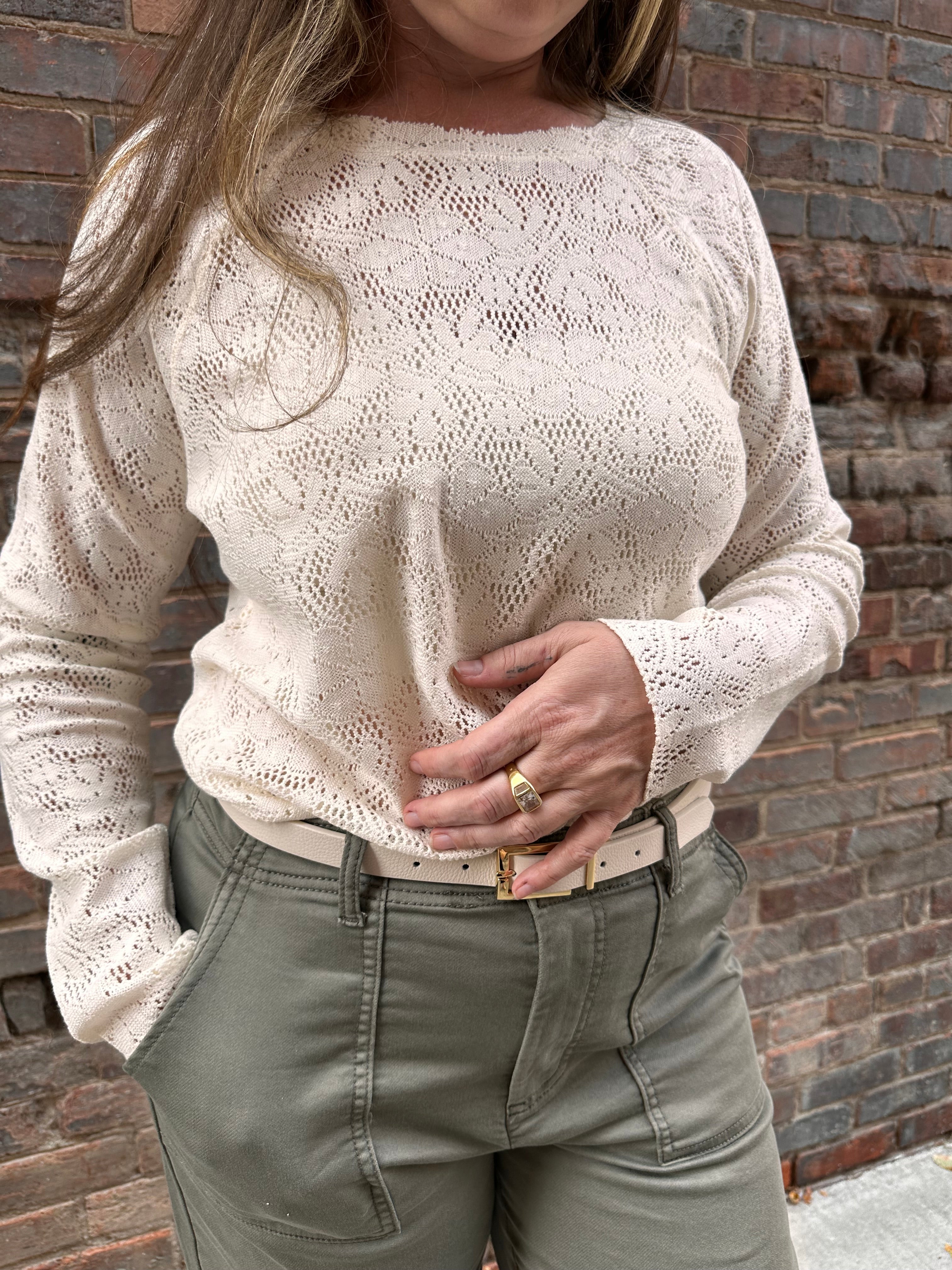 A cream lace long sleeve shirt