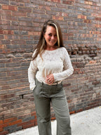 A cream lace long sleeve shirt