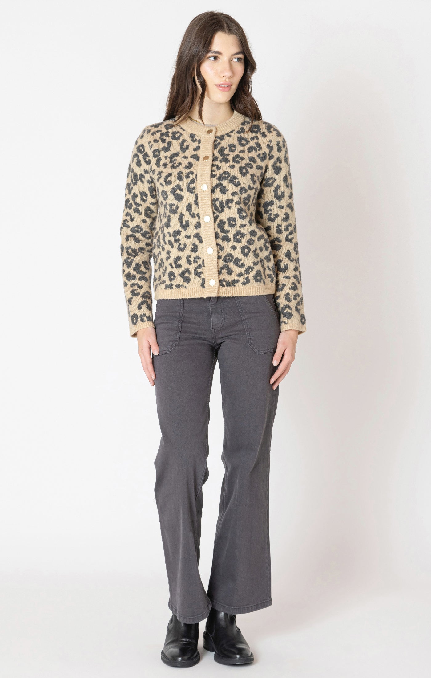 A tan cardigan with grey/black leopard print detail, with a button down front. 