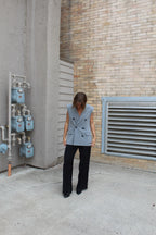 A grey suit jacket vest 