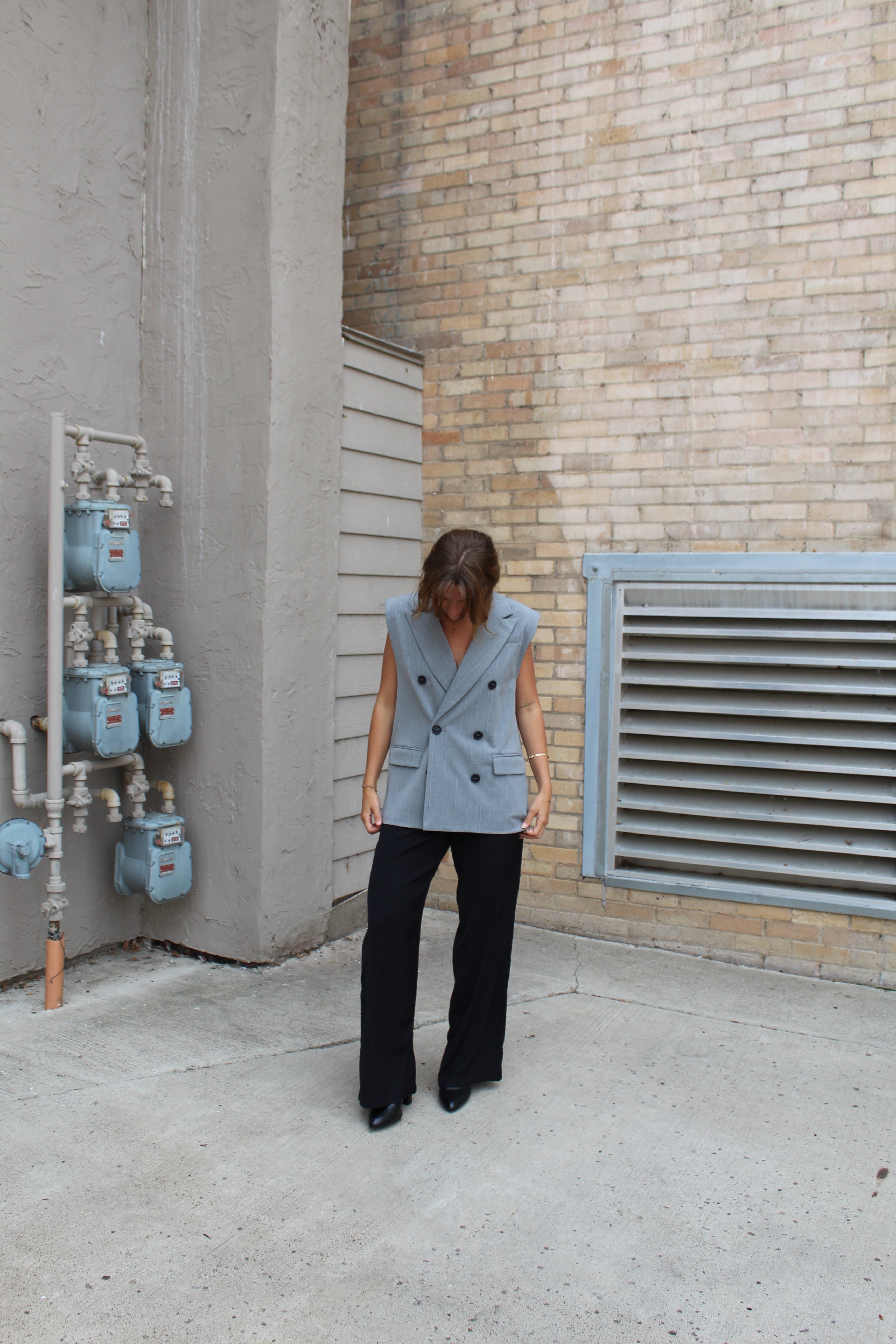 A grey suit jacket vest 