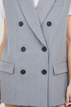 A grey suit jacket style vest, with double-breast buttons, slightly padded shoulders, and pinstripe details.