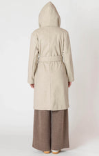 Oatmeal colored hooded trench coat jacket with a tie waist, and button front.