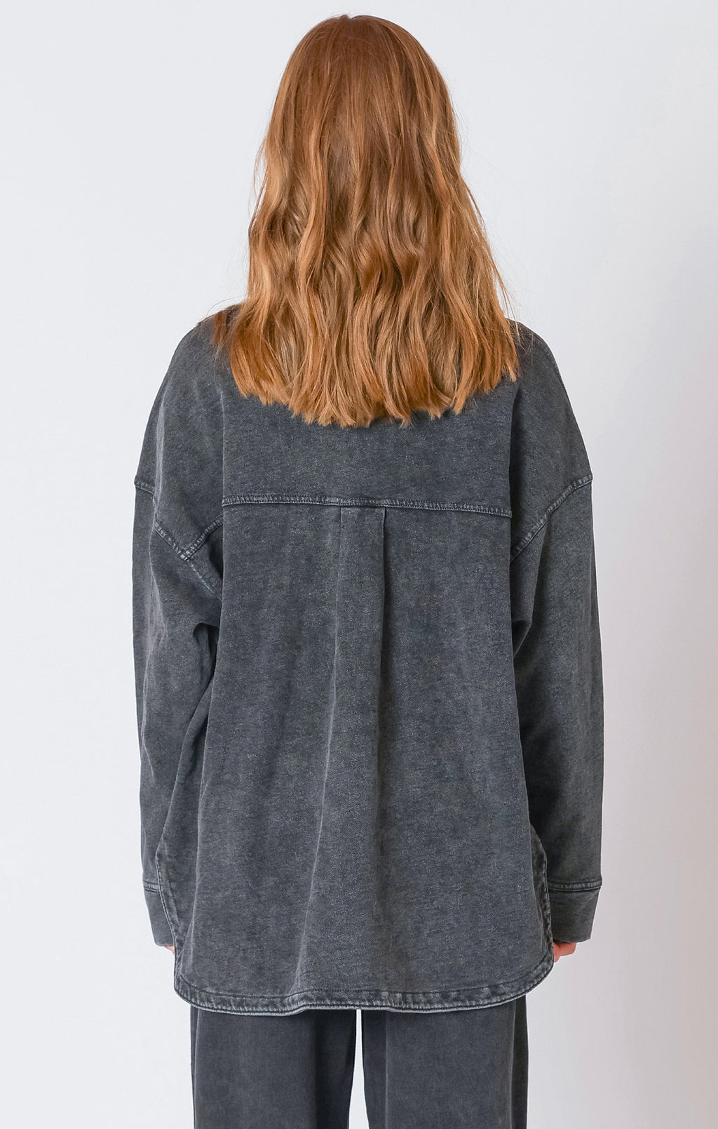 A charcoal button down light-weight jacket, that is perfect for the fall weather.