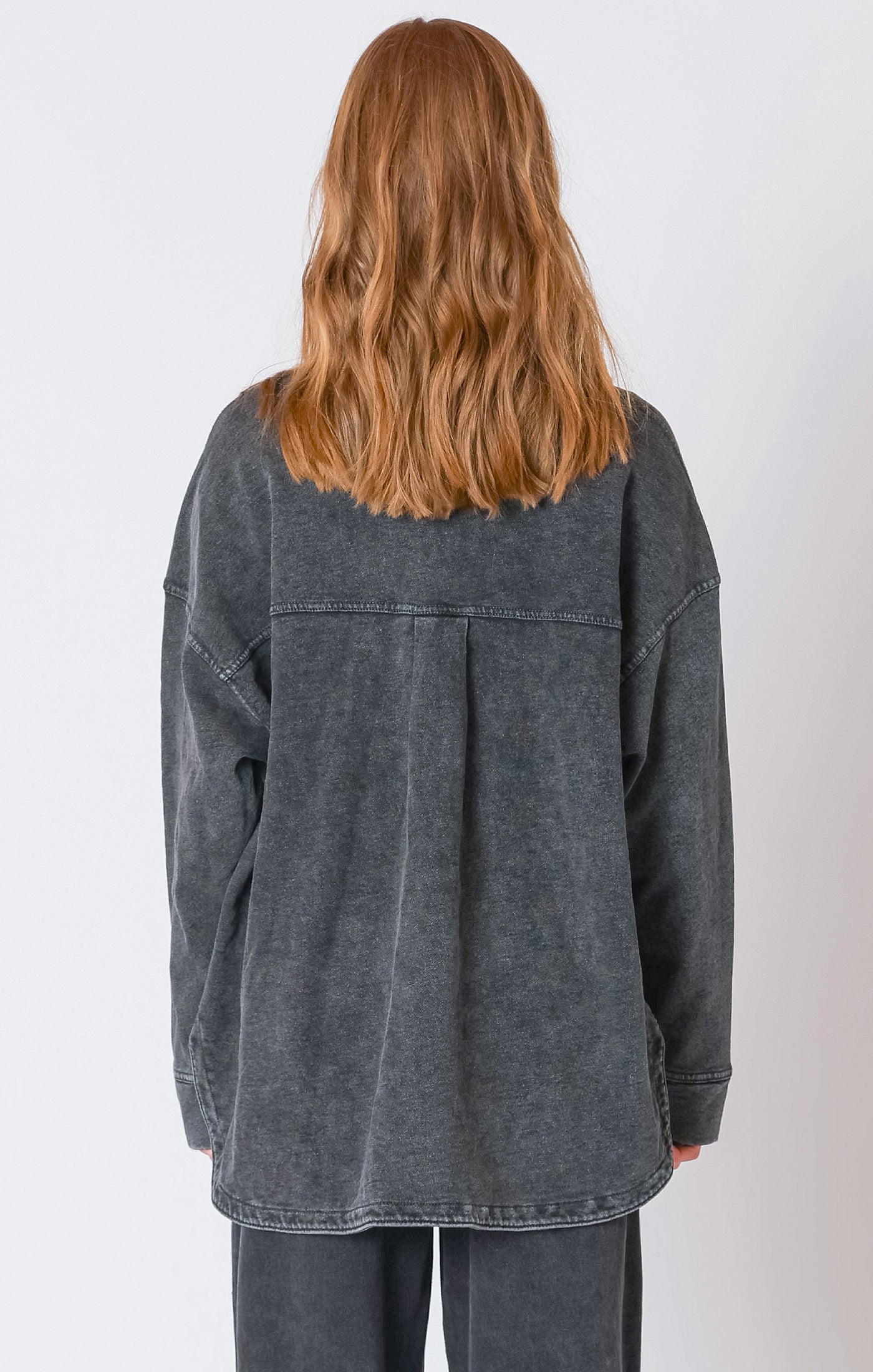 A charcoal button down light-weight jacket, that is perfect for the fall weather.
