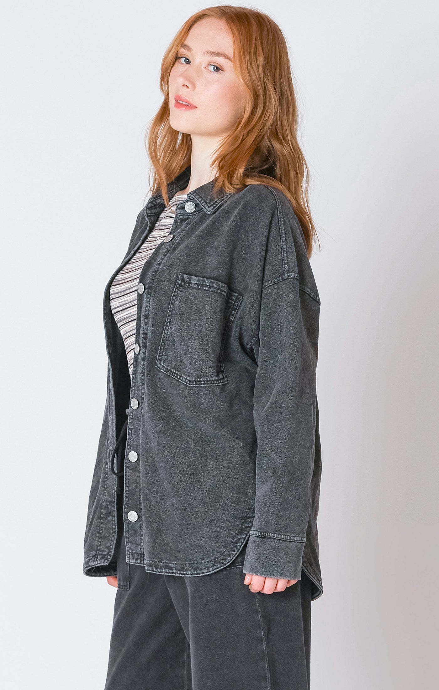 A charcoal button down light-weight jacket, that is perfect for the fall weather.