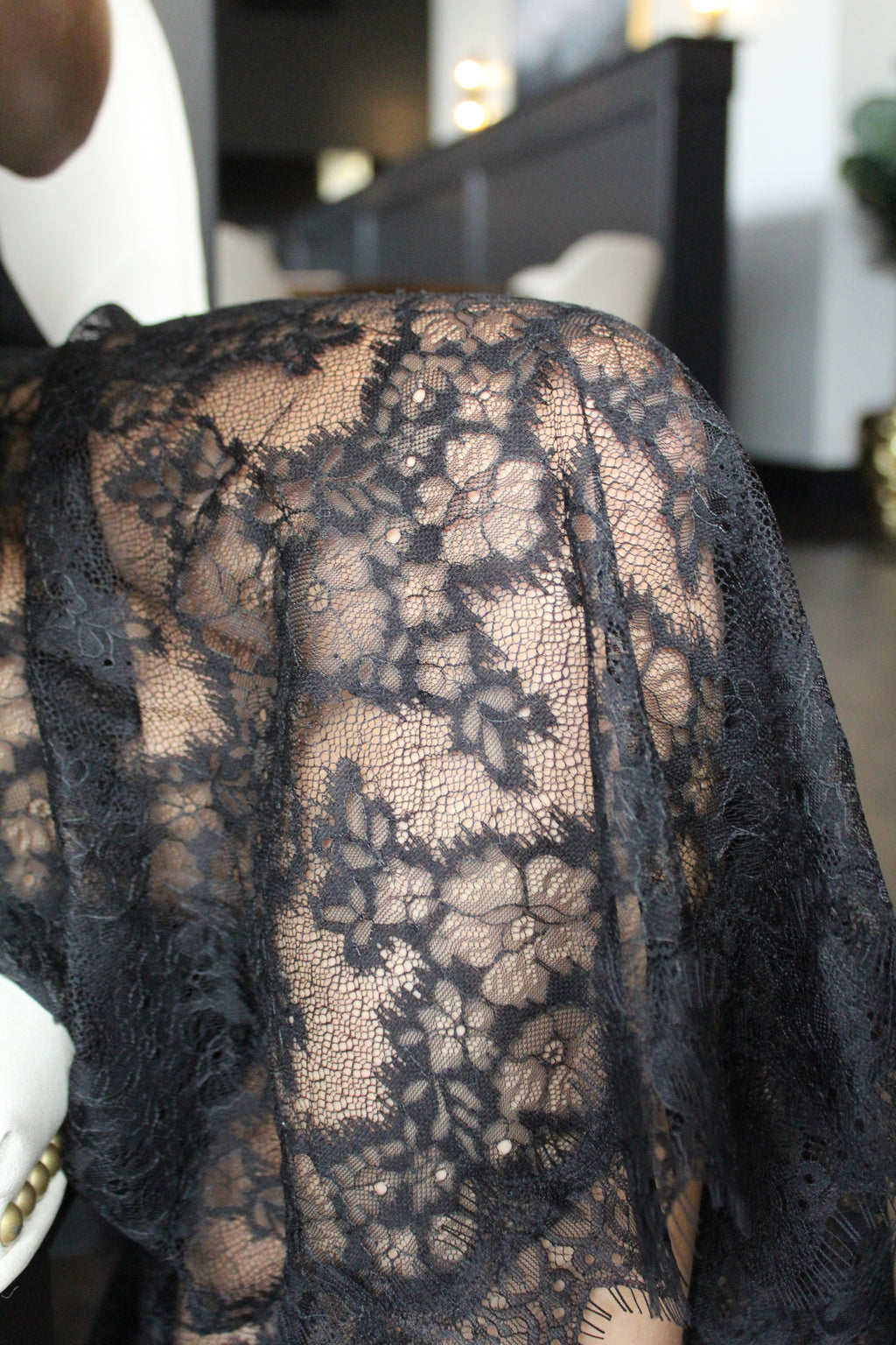 Black lace detail of bottom half of the skirt.
