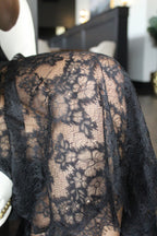 Black lace detail of bottom half of the skirt.