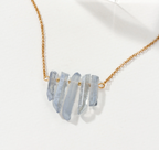 Necklace with blue stone pendants on a dainty gold chain