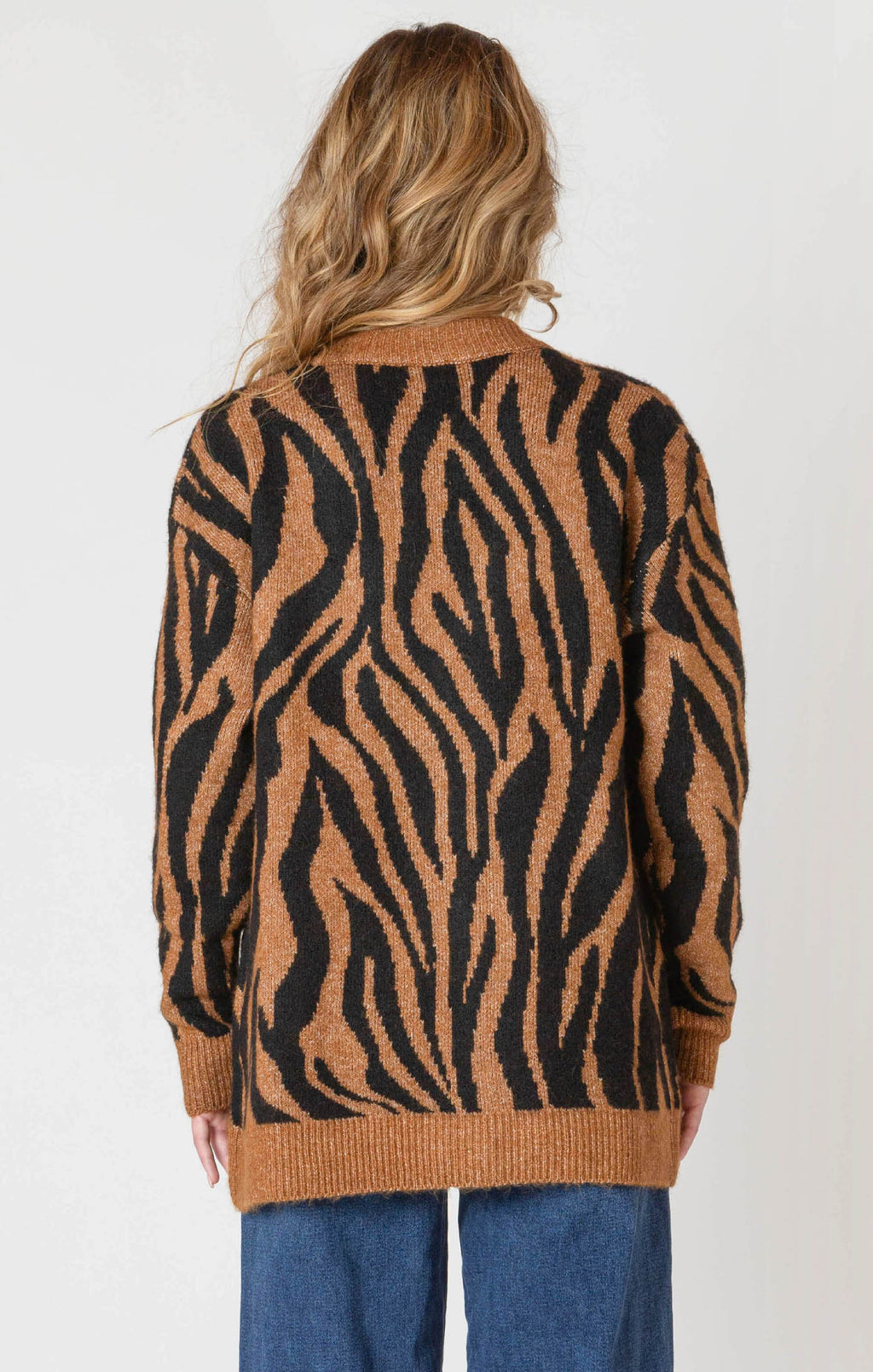 A luxuriously soft brown cardigan, with black animal print striping, pockets, and a button down front.