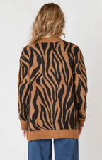 A luxuriously soft brown cardigan, with black animal print striping, pockets, and a button down front.
