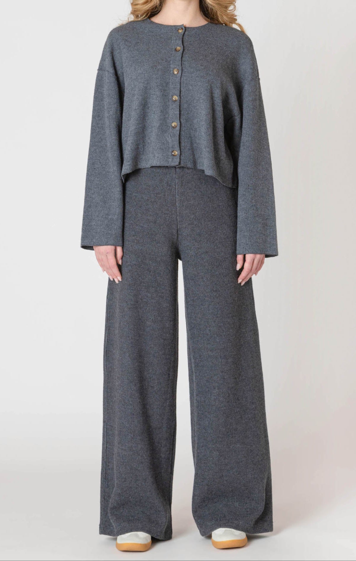 A luxurious knitted, stone grey, wide leg pant.