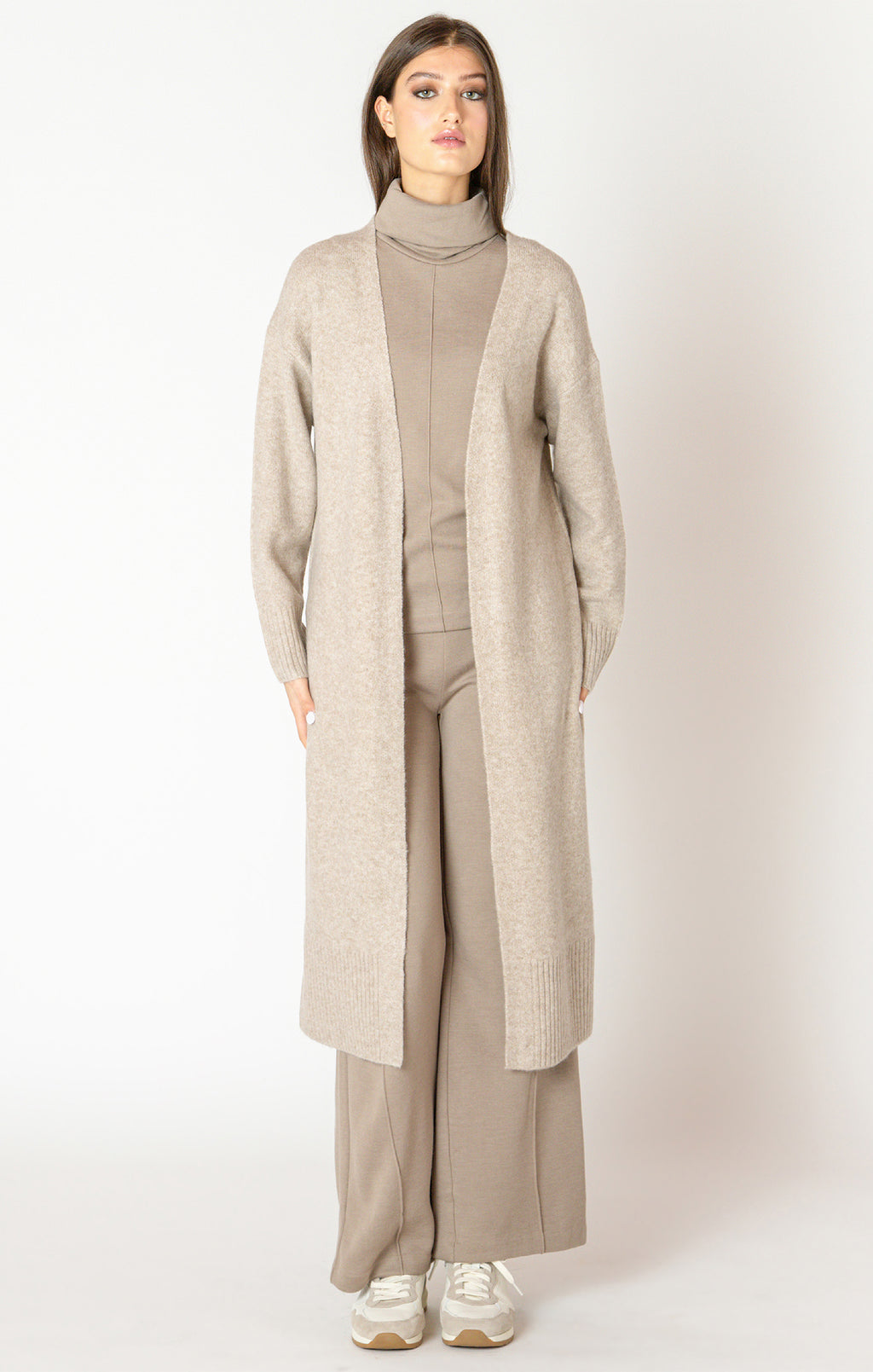 An elegant calf length open front sweater in a lovely oat color