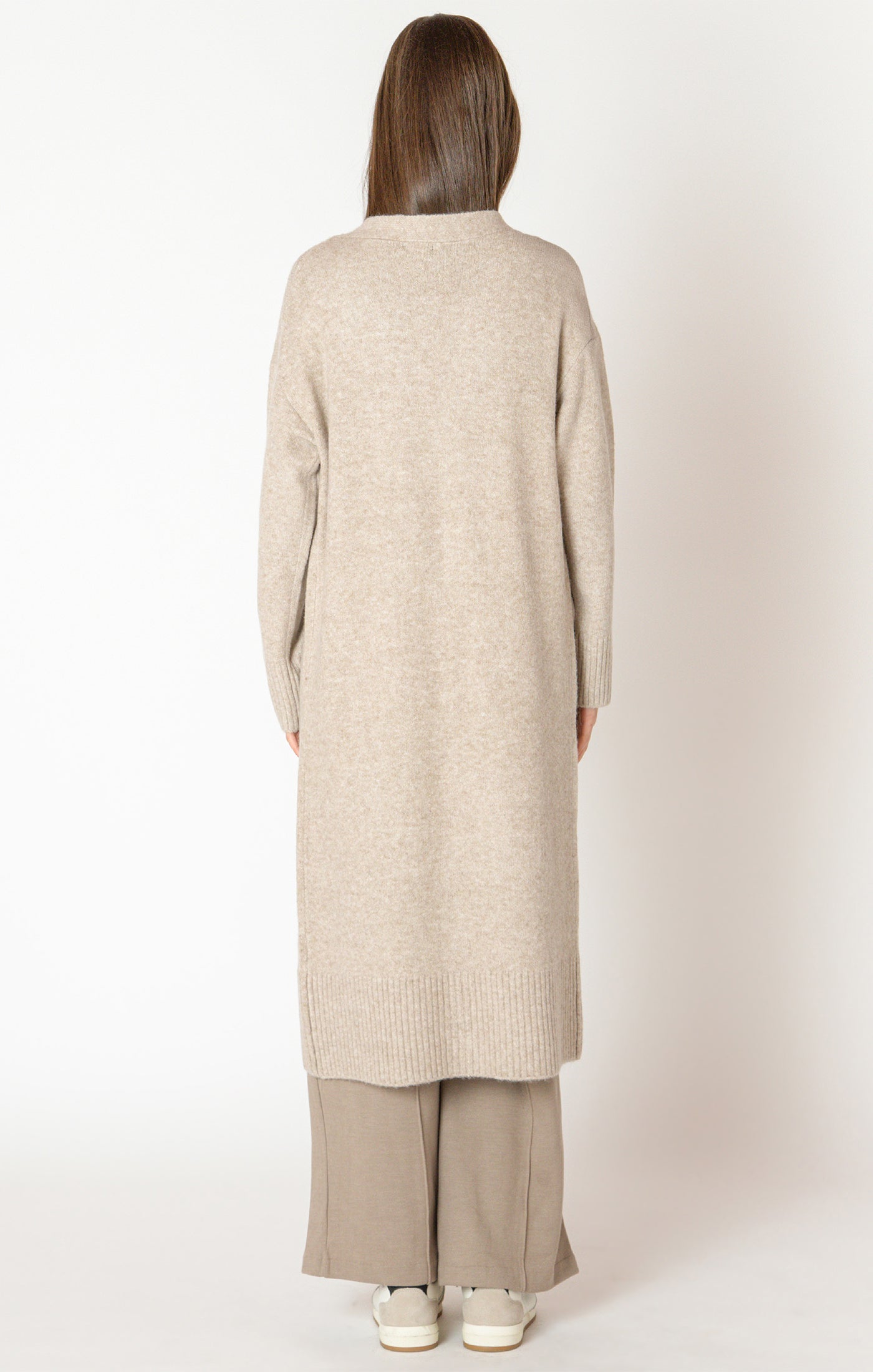 An elegant calf length open front sweater in a lovely oat color