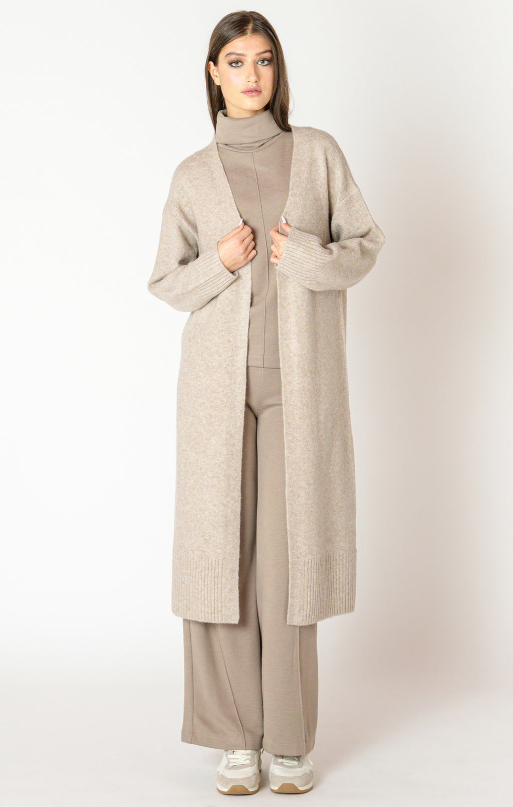 An elegant calf length open front sweater in a lovely oat color