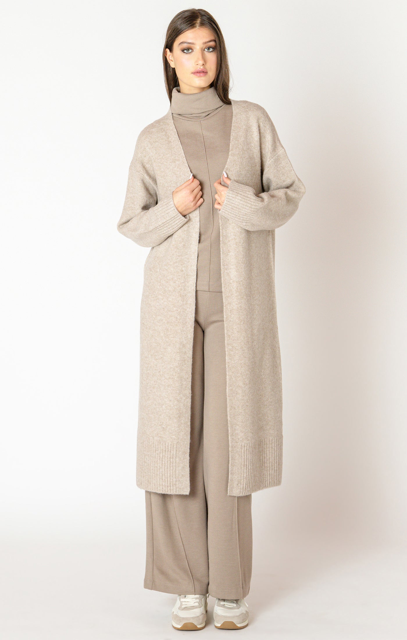 An elegant calf length open front sweater in a lovely oat color