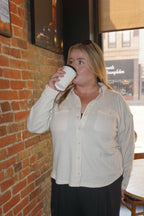 A wonderfully soft button up jacket, in a light weight waffle material, available in cream, dusty pink, or charcoal.