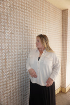 A wonderfully soft button up jacket, in a light weight waffle material, available in cream, dusty pink, or charcoal.
