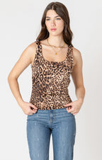 A timeless piece for any wardrobe, with a tan background, and realistic animal print, wide straps, and comfortable fabric.