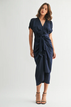 Woman wearing a navy blue dress on a white background