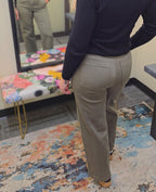 Olive colored pants on a woman