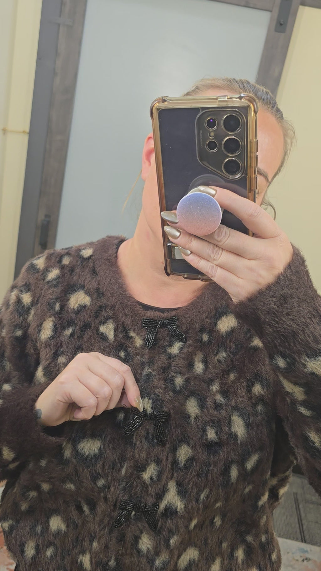 Fuzzy leopard print sweater with beaded bow buttons