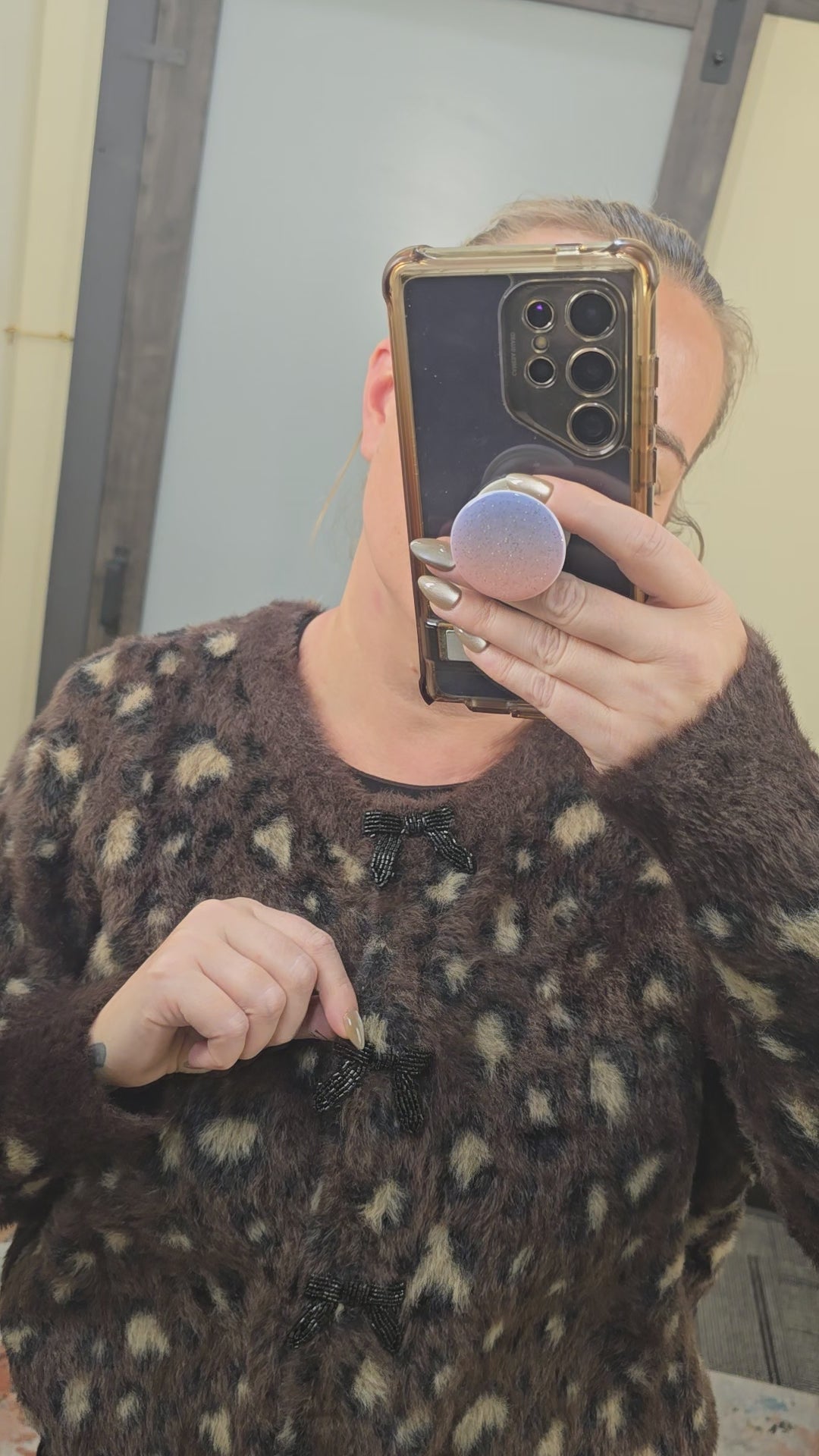 Fuzzy leopard print sweater with beaded bow buttons